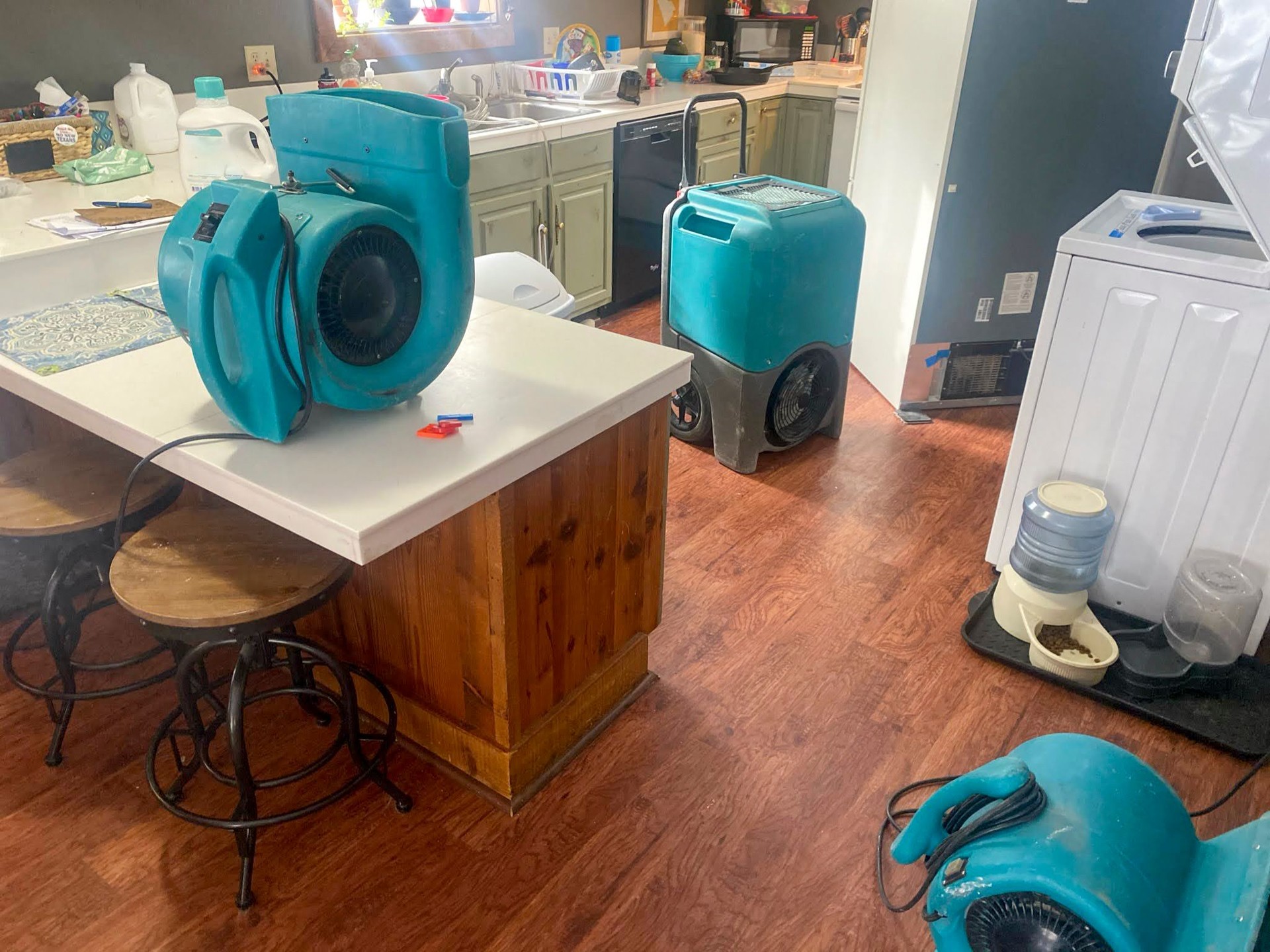 Water damaged room with air movers and a dehumidifier